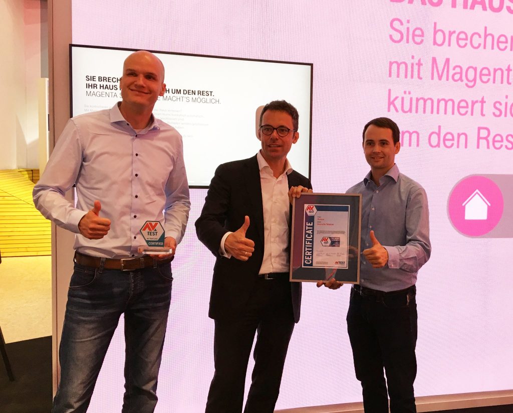 Carsten Steigleder, Senior Manager Smart Home at Deutsche Telekom, receives the certificate for the QIVICON Smart Home platform.